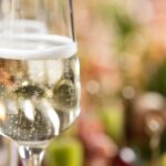 close up of white wines in glasses